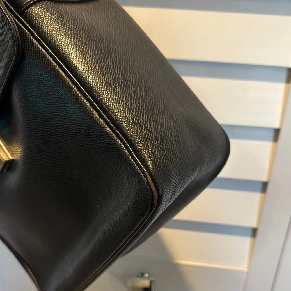 Louis Vuitton Authentic Taiga Yaranga Leather Vintage Bag with Adjustable Strap.
